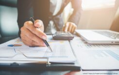 Business concept. Business people discussing the charts and graphs showing the results of their successful teamwork.